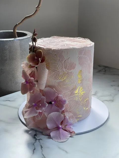 Pink wedding cake with flowers