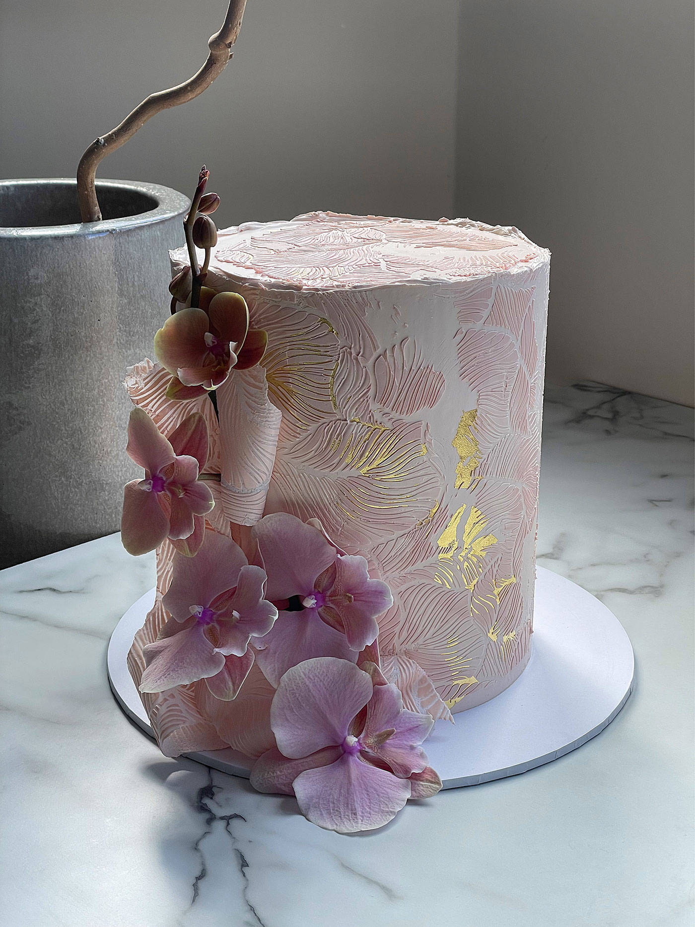 Pink wedding cake with flowers